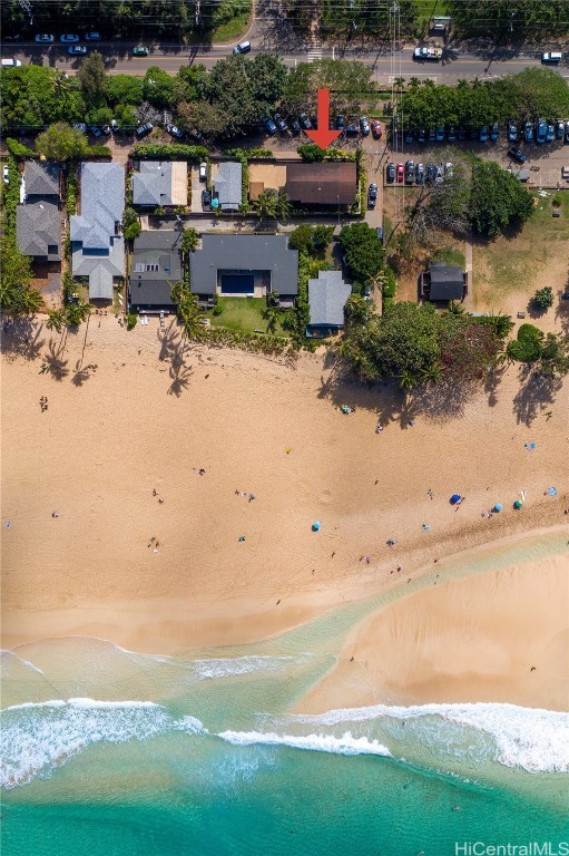 bird's eye view featuring a water view and a view of the beach