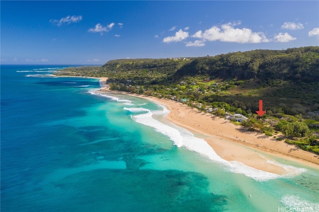 aerial view featuring a water view and a view of the beach