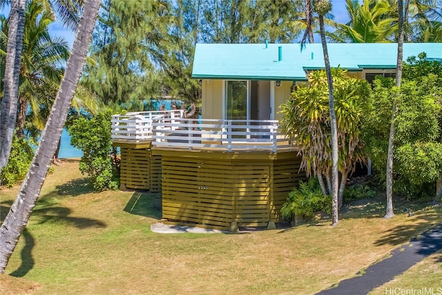 back of house with a yard and a deck