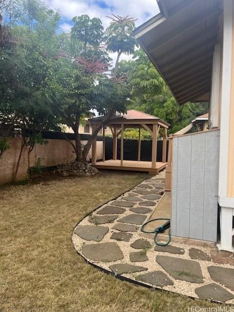 view of yard with a gazebo and a fenced backyard