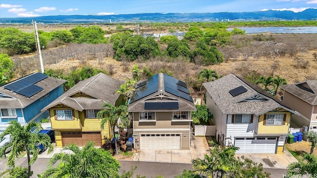 birds eye view of property featuring a mountain view