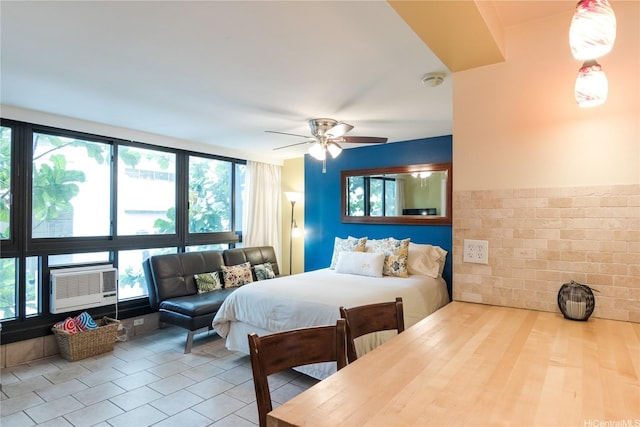 134 Kapahulu Ave Unit 219, Honolulu, HI 96815 - tiled bedroom with cooling unit and a ceiling fan