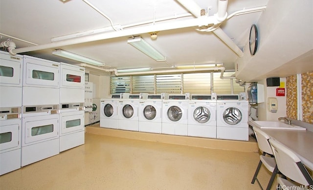 clothes washing area featuring washer and dryer and stacked washer and dryer