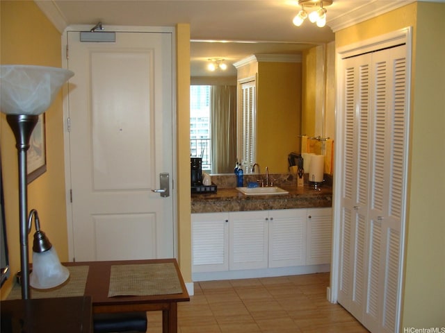 440 Olohana St Unit 1804, Honolulu, HI 96815 - bathroom with a closet, crown molding, and vanity