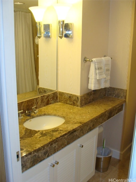 bathroom with vanity and tile patterned floors