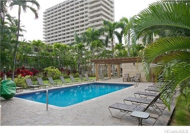 view of swimming pool featuring a patio and a pergola