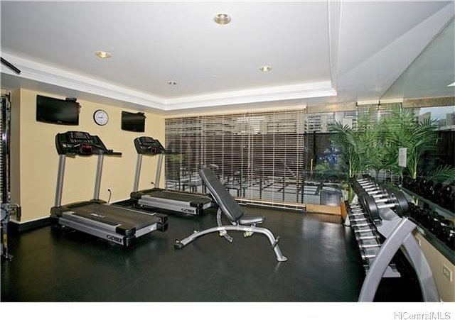 440 Olohana St Unit 1804, Honolulu, HI 96815 - workout area with a tray ceiling and recessed lighting