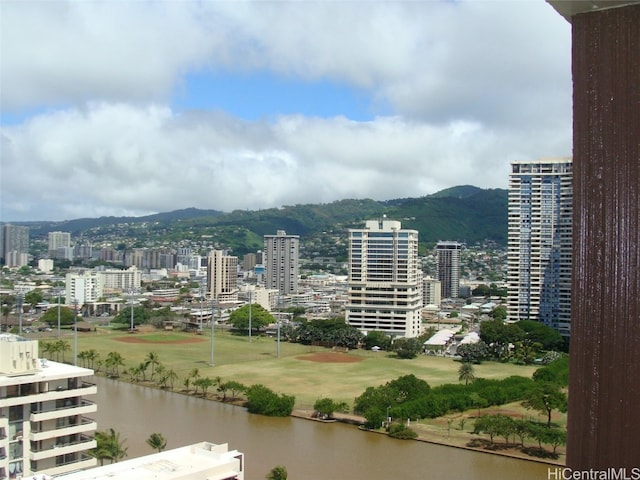 city view featuring a water and mountain view