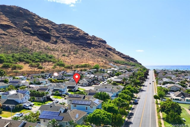 birds eye view of property with a mountain view