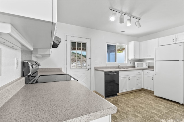 kitchen with track lighting, white cabinetry, black appliances, sink, and ventilation hood