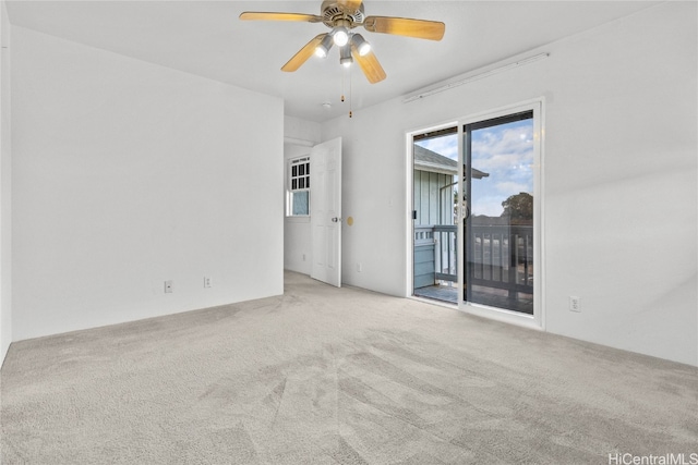 carpeted empty room with ceiling fan