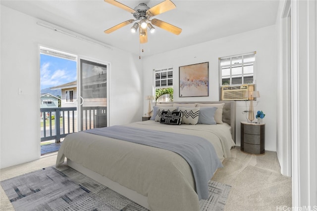 carpeted bedroom featuring cooling unit, access to exterior, and ceiling fan