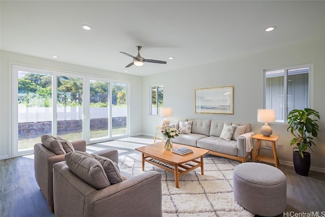 living room with light hardwood / wood-style floors and a healthy amount of sunlight