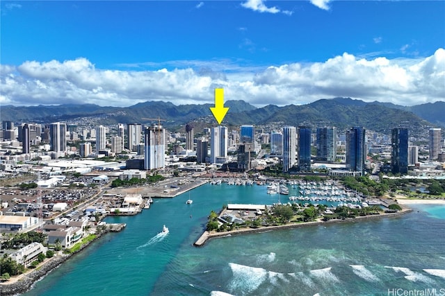 birds eye view of property featuring a water and mountain view