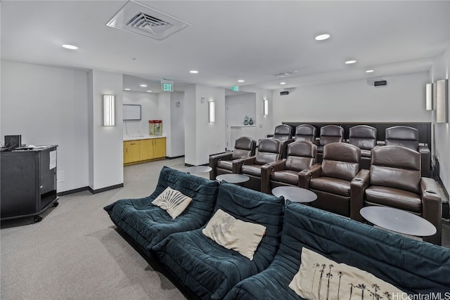 home theater room featuring light carpet