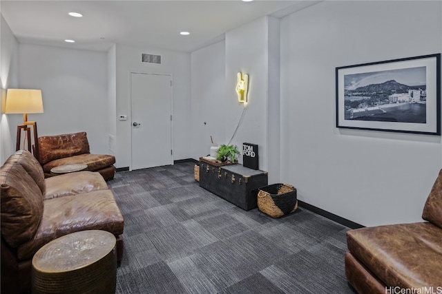 living room featuring dark carpet