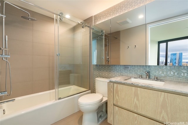 full bathroom featuring decorative backsplash, combined bath / shower with glass door, toilet, vanity, and tile patterned floors