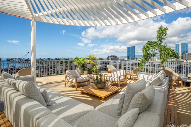 view of patio featuring a water view, a pergola, and outdoor lounge area