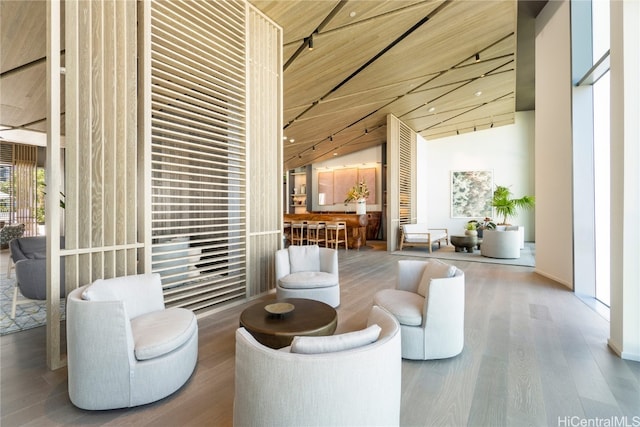 interior space with wood ceiling, hardwood / wood-style floors, and high vaulted ceiling