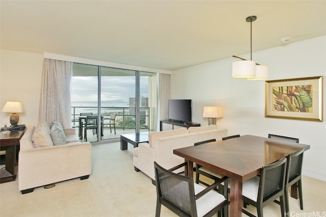 dining area featuring floor to ceiling windows