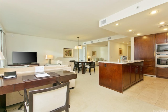 223 Saratoga Rd Unit 2607, Honolulu, HI 96815 - kitchen with appliances with stainless steel finishes, open floor plan, recessed lighting, a center island, and light stone countertops