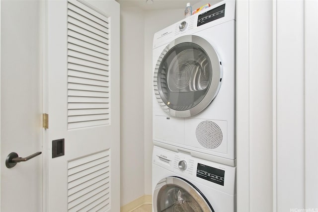 223 Saratoga Rd Unit 2607, Honolulu, HI 96815 - washroom featuring stacked washing machine and dryer and baseboards