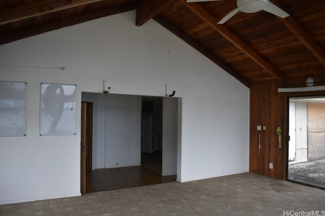 spare room with beamed ceiling, ceiling fan, wood ceiling, and carpet