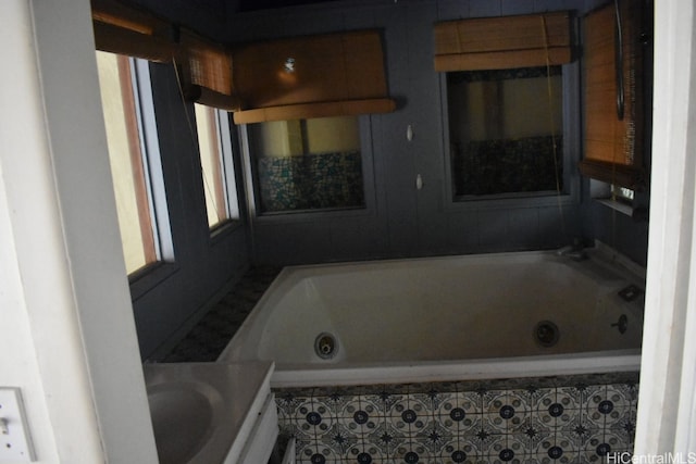 bathroom featuring tiled tub