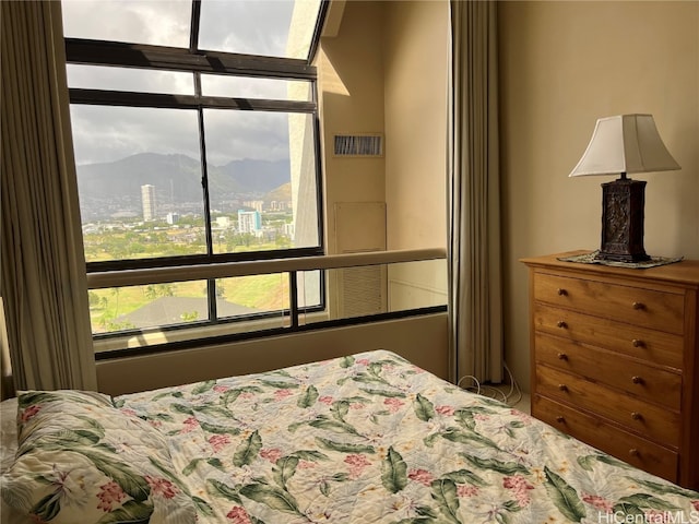 bedroom featuring a mountain view