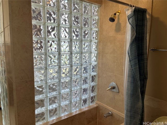 bathroom with a shower with curtain