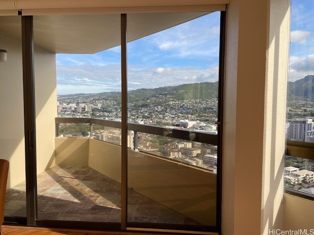 interior space featuring a mountain view, wood-type flooring, and plenty of natural light