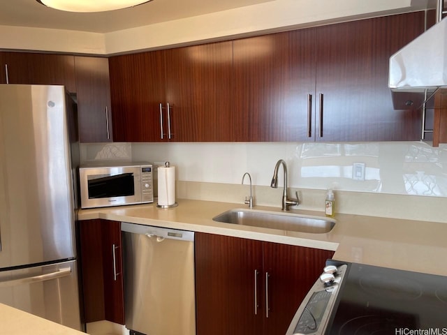 2499 Kapiolani Blvd Unit 3001, Honolulu, HI 96826 - kitchen featuring range hood, a sink, modern cabinets, light countertops, and appliances with stainless steel finishes