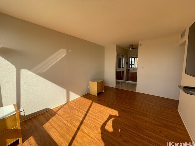 unfurnished living room featuring wood-type flooring