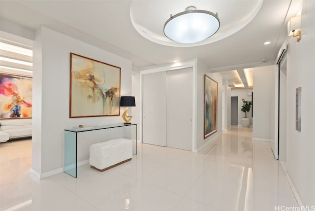 corridor featuring light tile patterned floors