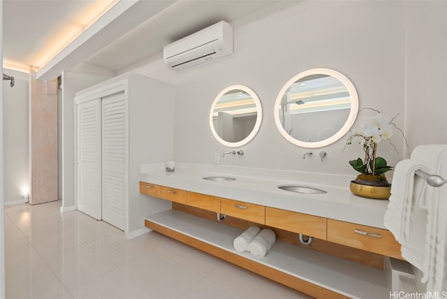 bathroom with a wall mounted AC, tile patterned flooring, and vanity