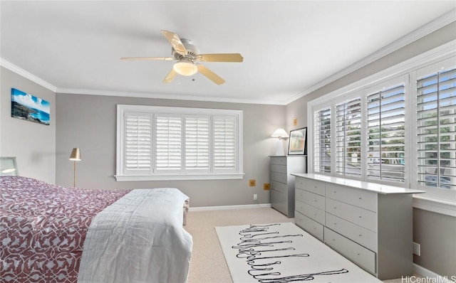 carpeted bedroom with ceiling fan and crown molding