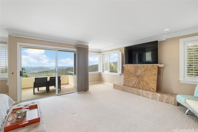 living room with carpet and ornamental molding