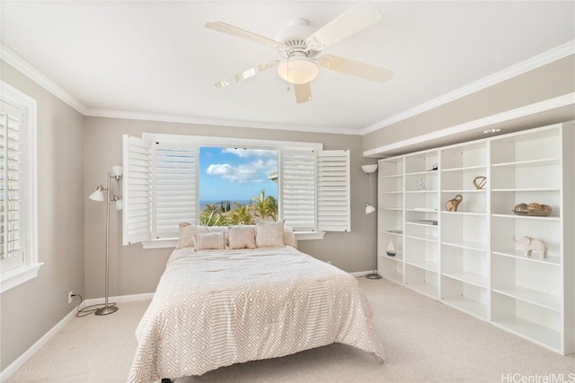 carpeted bedroom featuring ceiling fan, multiple windows, and crown molding