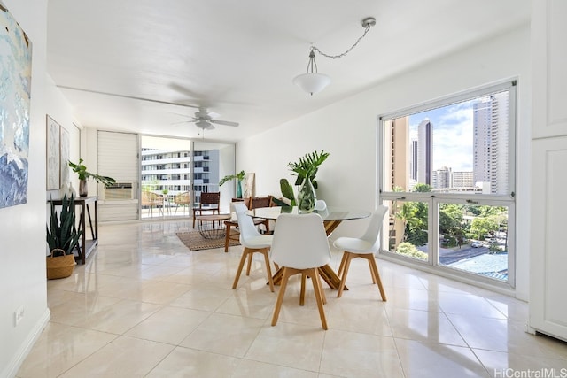 dining room with ceiling fan and light tile patterned flooring