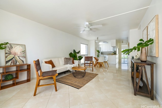 tiled living room featuring ceiling fan