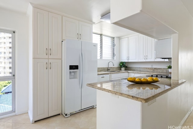 kitchen with sink, white cabinetry, white appliances, and plenty of natural light