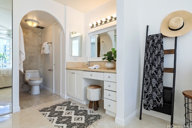 bathroom with toilet and vanity