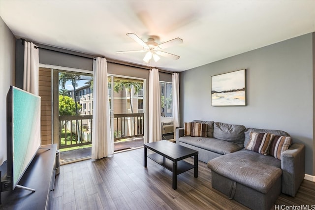 living room with dark hardwood / wood-style floors and ceiling fan