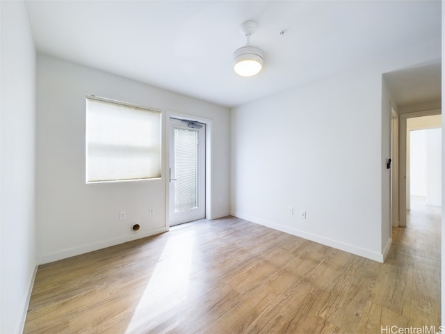 empty room with light hardwood / wood-style floors