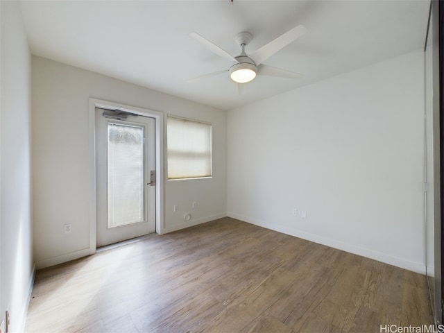 unfurnished room with light hardwood / wood-style flooring and ceiling fan