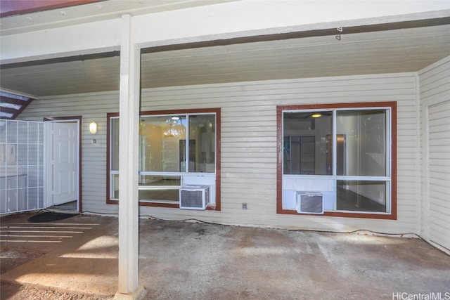 view of patio featuring a wall mounted air conditioner