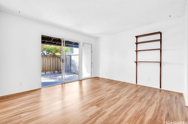 spare room featuring light hardwood / wood-style flooring