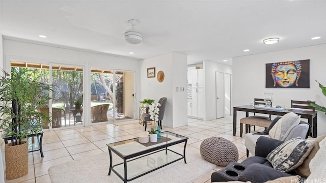 tiled living room featuring ceiling fan