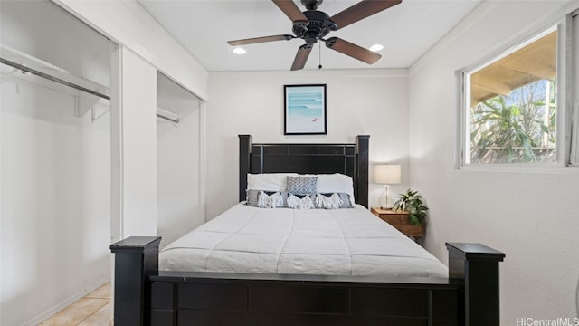 bedroom featuring light tile patterned floors and ceiling fan