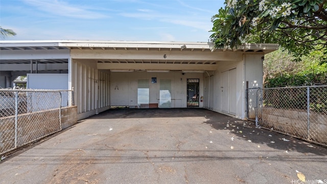 exterior space with a carport